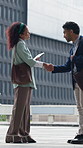 Business people, meeting or city with handshake for introduction, guide or direction. Businessman, woman or employees shaking hands with job opportunity for career onboarding or help in an urban town