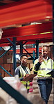 Inspection, logistics and walking with black people in warehouse together for quality control. Checklist, clipboard and tablet with supply chain team in factory for inventory or stock management