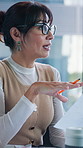 Business, woman and talking with document in meeting for planning, legal advice and case file. Mature person, lawyer and briefing with folder for evidence, witness statement and testimony for lawsuit