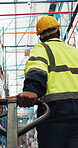 Logistics, walking or man with trolley in warehouse, shipment import or export package for delivery. Pallet jack, supply chain or person with cargo transport for distribution, back or below in depot