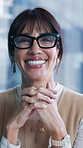 Marketing, face or woman in agency with glasses, laugh or ambition in advertisement industry. Confidence, happiness or mature creative director with specs, about us or experience in brand development