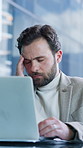 Headache, laptop and businessman in office with mistake, burnout or fatigue for finance report deadline. Computer, migraine and male financial manager with exhaustion for investment proposal error.