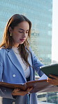 Reading, documents and businesswomen with tablet in city, team and planning for property investment. Outdoor, collaboration and people with tech for real estate listing, serious and talk with report