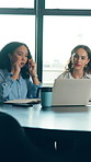 Women, laptop and business meeting in office with discussion, task delegation and planning. Project management, conversation and team brainstorming for proposal, deal or development for training