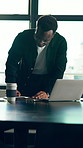 Reading, notebook and black man in office with laptop, check schedule or reminder for marketing work. Person, review diary and agenda in business with computer, plan and idea for advertising project.