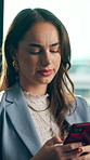 Disappointed, woman and typing in office with phone, bad news or doubt project for digital marketing. Confused, person and scroll in business with tech, social media crisis or mistake for advertising