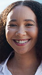 Face, confident and business woman with smile in city, property development career and professional. Portrait, outdoor or person with pride for urban planning, housing market or real estate industry