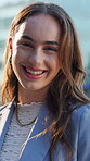Face, confidence and business woman with smile in city, property development career and professional. Portrait, laugh or person with pride for urban planning, housing market or real estate industry