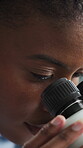 Microscope, exam and science with black woman in laboratory for research, disease cure and dna. Medical sample, microbiology review and vaccine trial with person in clinic for healthcare study