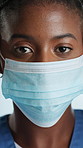 Black woman, face and mask with protection for viral disease, health and safety in hospital. Portrait, female person or nurse with mouth cover for pandemic, bacteria or germ prevention in clinic