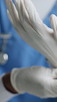 Nurse, hands and latex with gloves for operating preparation, hygiene or protection in hospital. Person, healthcare worker or getting ready with surgical equipment for medical emergency in clinic OR