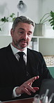 Mature, businessman and lawyer with laptop for video call, online legal advice or tips in office. Man, employee or attorney explaining steps on computer for proposal, terms or conditions on testimony