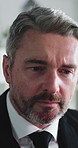 Business, investor and man in office, reading for investment report or stock market exchange. Mature person, strategy and employee in workplace, research for trading portfolio and review finance plan