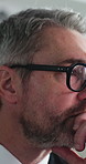 Investor, glasses and man in office, reading and planning for annual review for profit increase. Mature person, professional and financial planner in workplace, eyewear and feedback for economy info
