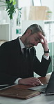 Stress, headache and businessman in office with laptop for mistake in stock market with loss. Computer, migraine and mature male financial manager with pressure for investment proposal deadline.