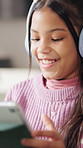 Headphones, reading and girl with tablet in house, streaming movie and subscription site to watch show. Smile, film series and child with tech for multimedia app, weekend entertainment or connection