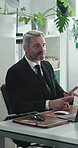Mature, businessman and meeting with financial advisor for discussion or administration in office. Man, business agent or explaining terms and conditions with laptop for finance advice in workplace