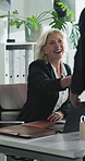 Mature, woman and financial advisor with handshake for meeting, introduction or greeting in office. Female person, business or shaking hands with client for finance advice or corporate administration