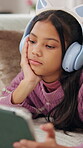 Streaming, headphones or kid in house with tablet, movie binge or cartoon watching on digital app. Relax, multimedia or girl on floor with tech, child series or subscription on entertainment platform