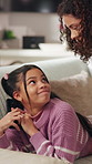 Mother, child and phone secret in home with hidden social media, check or monitor for online safety. Sneaky, girl and mom in living room with tech, supervision or responsibility for internet security
