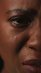 Face, crying and woman with depression, stress and mental health for sad memories of emotional abuse. Closeup, tears and upset black person with anxiety, loneliness or despair for tragedy experience.