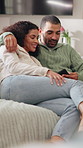 Relax, cuddle or couple with phone on sofa, share social media post or reading digital news together. Bonding, support and happy people with mobile app for connection, watch video and chill in home