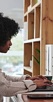 Library, student and woman with laptop for research, education and exam preparation with info on web. Serious, elearning and black person with tech for online course, knowledge and studying for test