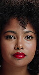 Serious, face and woman with afro, studio or cosmetic for healthy natural texture, glow and haircare. Hair, growth and person with pride for makeup, gray background and beauty with lipstick in Brazil