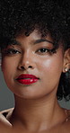 Makeup, face and woman with afro, haircare or cosmetics for healthy natural texture, glow and studio. Hair, growth and person with pride for beauty, gray background and smile with lipstick in Brazil