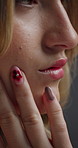 Manicure, skincare and woman in studio with soft face, beauty and natural facial glow for confidence. Nails, cosmetics and female person with dermatology for health or wellness by gray background.