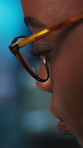 Black woman, night and developer with glasses in office for software development, app or update. Profile, female person or programmer with spectacles for coding, troubleshooting or cybersecurity
