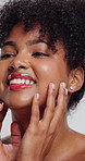 Happy, skincare and woman in studio with soft face, glow and facial cosmetics for confidence. Manicure, natural beauty and female person with cosmetology for health or wellness by white background.