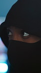 Person, hacker or night with hoodie or mask for programming, coding or cybersecurity breach. Programmer, developer or IT criminal spy in late evening or ransomware for malware, phishing or cybercrime