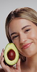 Skincare, face and woman in studio with avocado for natural, organic or hydration routine. Cosmetic, glow and portrait of female person with fruit for facial dermatology treatment by white background