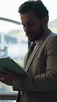 Business, man and reading with tablet in office for research, email client and real estate. Mature person, scroll or digital to review schedule, pricing property and online inquiry for resale listing