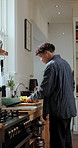 Cooking, recipe and man in kitchen, ingredients and prep for vegetarian meal, knife and culinary skills. Process, cutting board and person in home, nutrition and vegetables for diet and healthy food