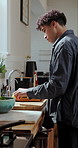 Cooking, recipe and man in kitchen, bowl and prep for vegetarian meal, salad and culinary skills. Process, cutting board and person in home, nutrition and vegetables for diet, knife and healthy food