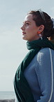 Woman, thinking and reflection at beach on vacation with breathe, memory or break at seaside. Person, outdoor and perspective by ocean view in nature, nostalgia and daydream with blue sky on holiday