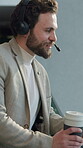 Speaking, coffee and man with headset in office, call center and cold calling for telemarketing pitch. Smile, beverage and sales consultant with tech for networking, explain offer and lead generation