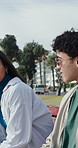 Couple, talk and relax on park bench with smile, memory and bonding on break, date or story. People, partner and relationship for conversation, happy or chat for care, love and connection in city