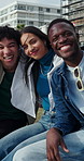 Friends, face and hug with smile on park bench for bonding, connection and reunion in urban town. Happy people, gen z group and embrace in portrait, solidarity and outdoor with diversity in city