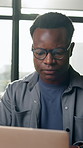 Frustrated, glasses or black man with laptop in agency, negative project feedback or campaign reviews. Window, disappointed or marketer with pc to monitor launch, eyewear or audience comments stress