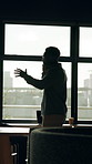 Black man, discussion and window with phone call in office for real estate negotiation or advice. Businessman, realtor or building investor talking with smartphone for property investment or proposal