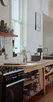 Kitchen, empty and stove with counter for cooking in restaurant for cuisine, meal prep and catering. Background, hospitality and room with utensils, appliances and equipment for culinary business