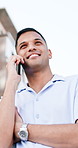 Speaking, phone call and business man in city, planning viewing and negotiation for property price. Town, below and happy real estate agent with mobile for communication, seller update and scheduling