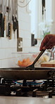 Hands, man and cooking food in pan with butter, prepare steak and searing process. Chef, stirring and meat in oil ingredient for natural spices, gourmet cuisine and flavor for recipe in kitchen