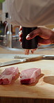 Steak, chef and people with pepper kitchen for learning culinary skills, cooking and recipe. Restaurant, catering and men with seasoning, meat and prepare for dinner, gourmet meal or cuisine together