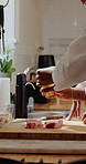 Steak, chef and people with seasoning in kitchen for learning culinary skills, cooking and recipe. Restaurant, catering and men with meat and ingredients for dinner, gourmet meal and cuisine together