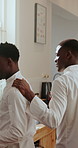 Black man, chef and conversation in kitchen for greeting, advice or listen for restaurant training. People, mentor and team discussion with learning, culinary arts and cuisine with cooking and frying