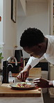 Cooking, black man and chef with steak in kitchen for culinary skills, herbs and flavor or presentation. Healthy, meal prep and person with meat dish, hospitality and protein on plate for restaurant